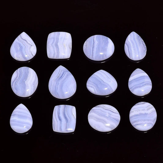 Natural blue lace agate gemstone cabochons mixed shapes on white background ā individual pieces
