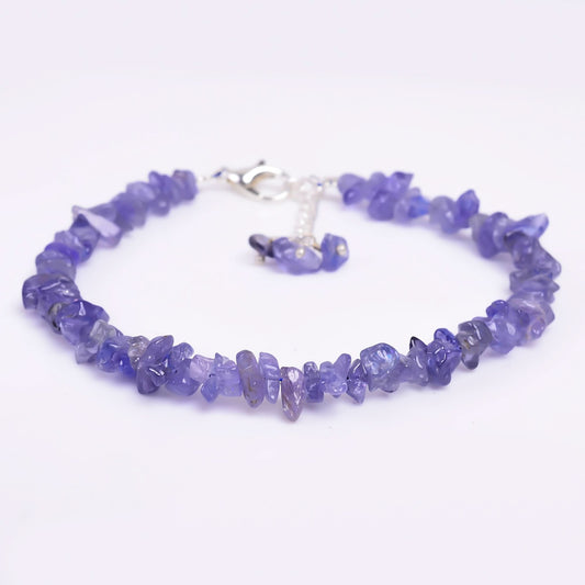 Purple beaded bracelet on a white background
