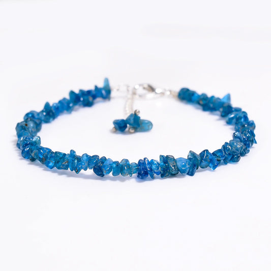 Blue beaded necklace on a white background