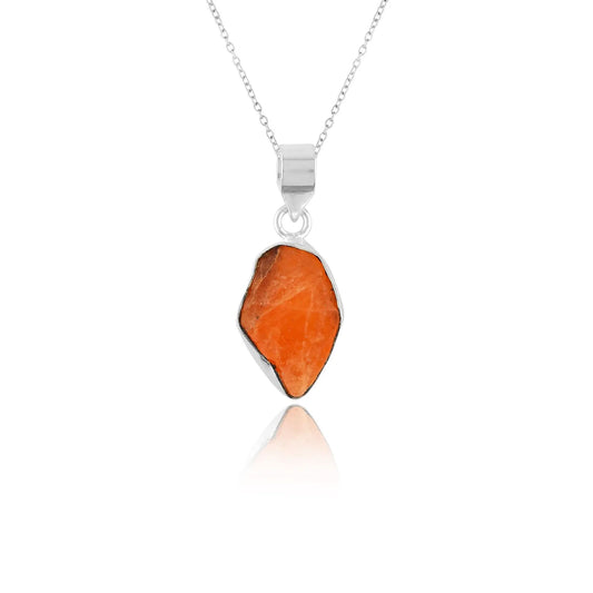 Orange triplite raw gemstone pendant in bezel setting shown on silver-plated chain against a clean white studio background