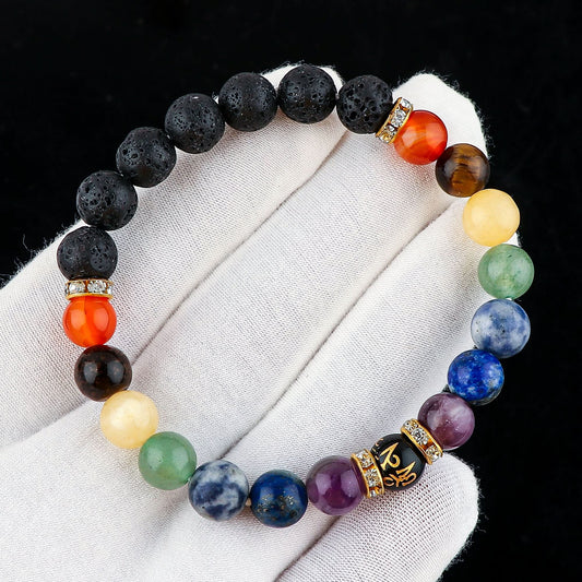Multicolored beaded bracelet on a white fabric background
