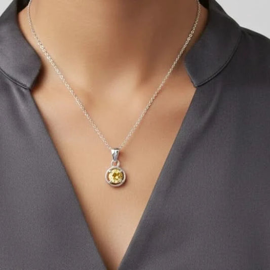 Vibrant yellow faceted Citrine gemstone pendant in classic silver circular mount