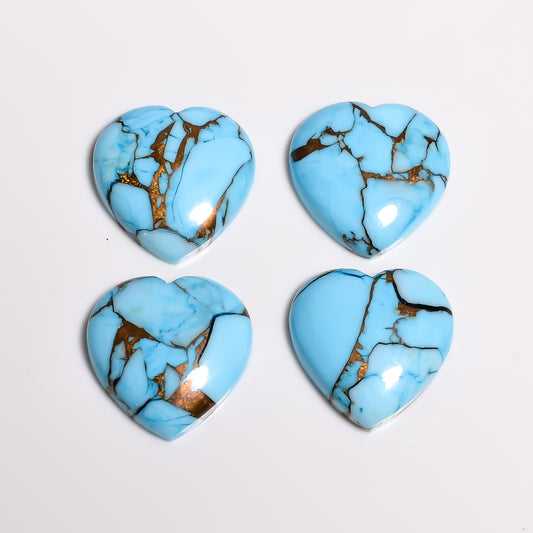 Close-up of the soft sky tone on this light blue turquoise heart, showing how light sits across the polished dome