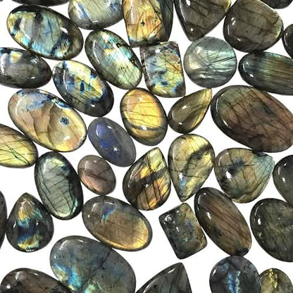 Labradorite gemstone cabochons in hand – size reference 20-35mm A+ quality pieces