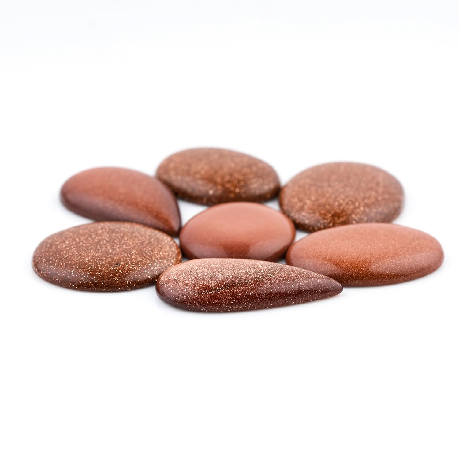 sunstone crystal meaning Brown stones on a white background
