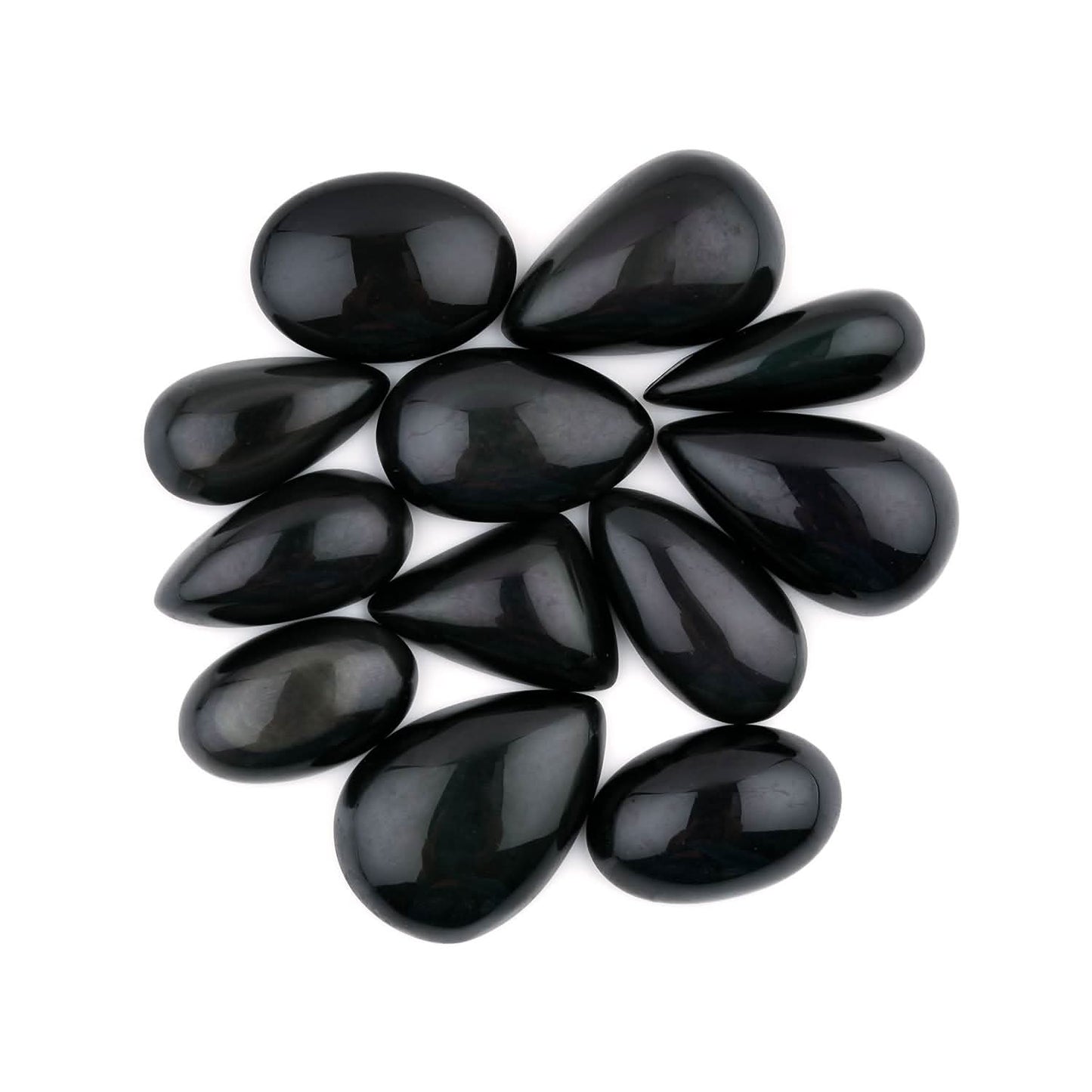 Black teardrop-shaped stones arranged in a circular pattern on a white background