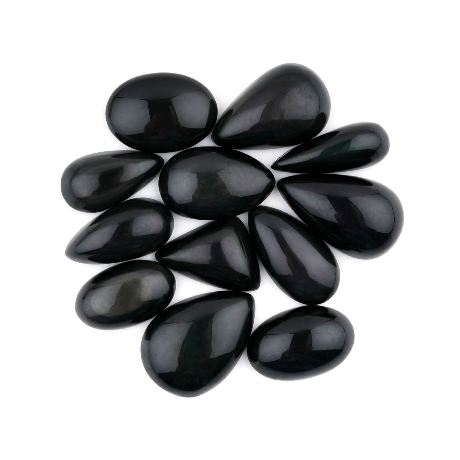 Black teardrop-shaped stones arranged in a circular pattern on a white background