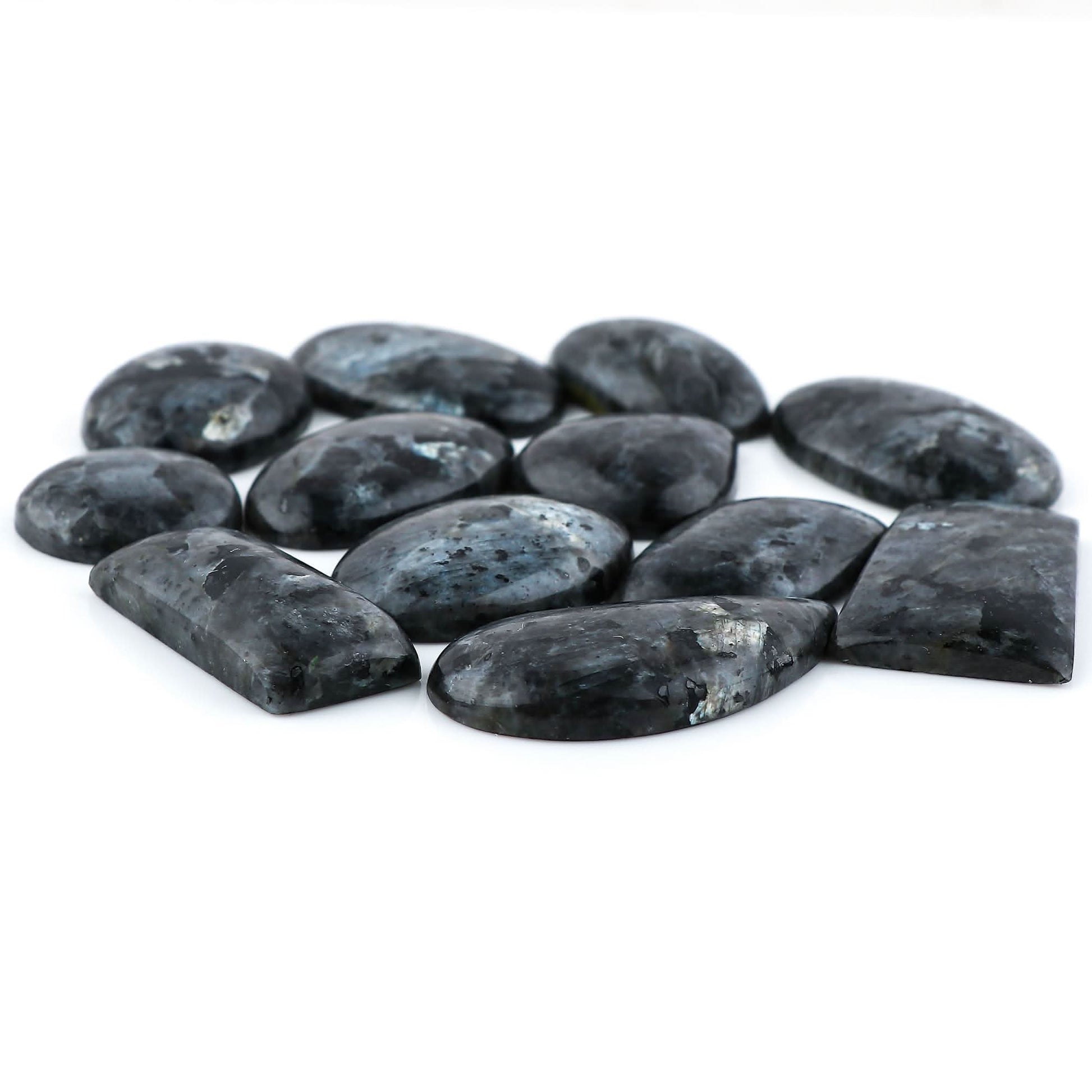 Larvikite cabochon lot mixed shapes on white background – oval teardrop freeform flat back