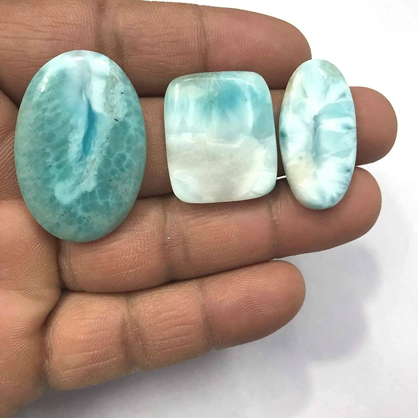 Blue larimar cabochon showing natural sky blue and white pattern
