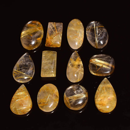 Collection of yellow and clear crystal stones on a black background