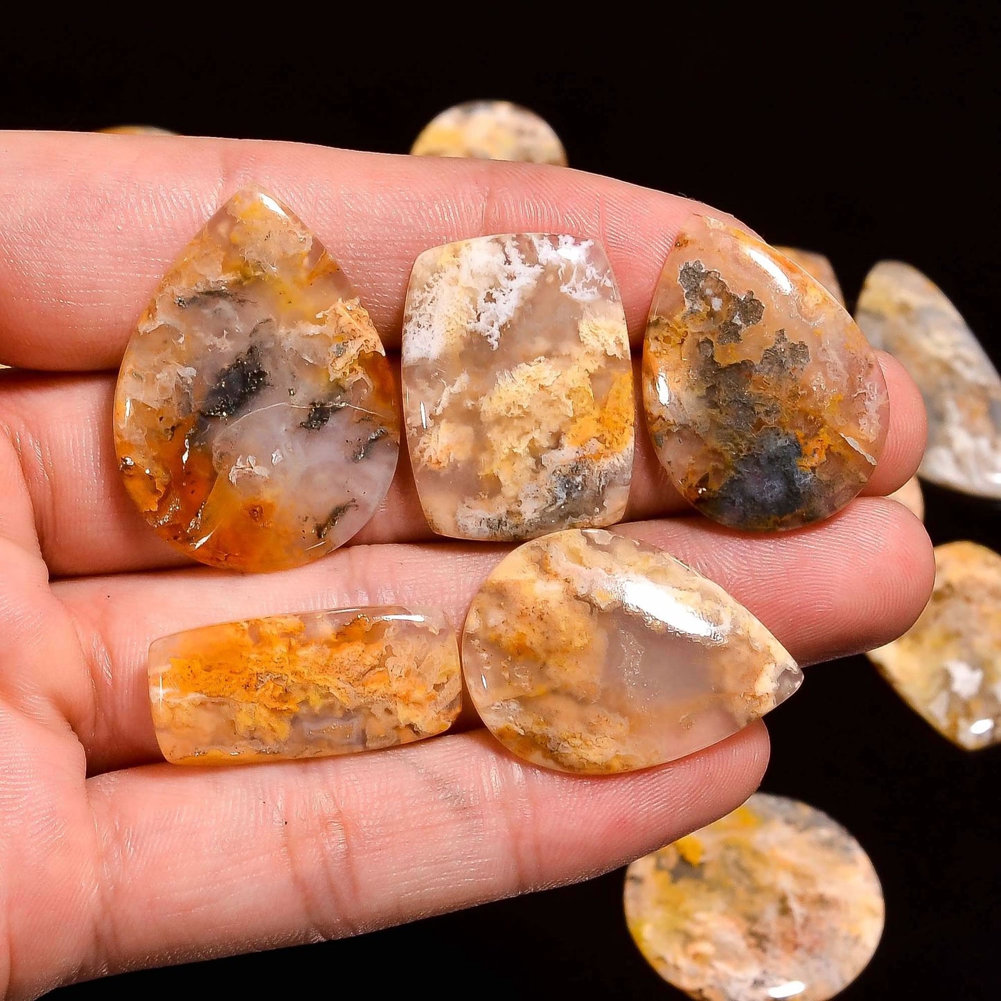Real plume agate cabochon showing feathery plume pattern inside
