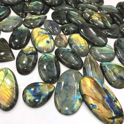 Natural labradorite cabochon mixed shapes teardrop oval freeform – close up labradorescence detail
