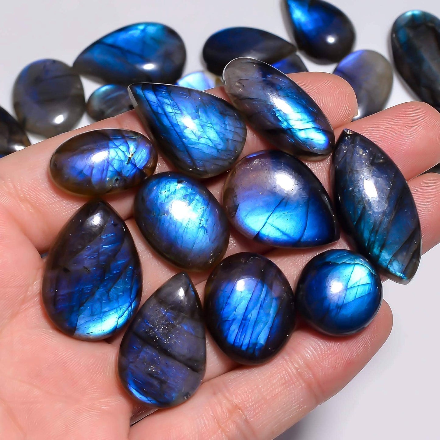 Hand holding blue labradorite gemstone healing properties​ 