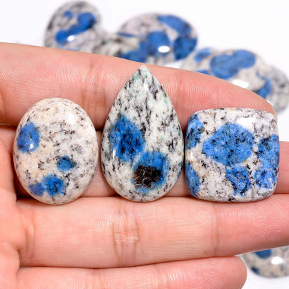 K2 jasper gemstone showing natural azurite blue spots on white granite
