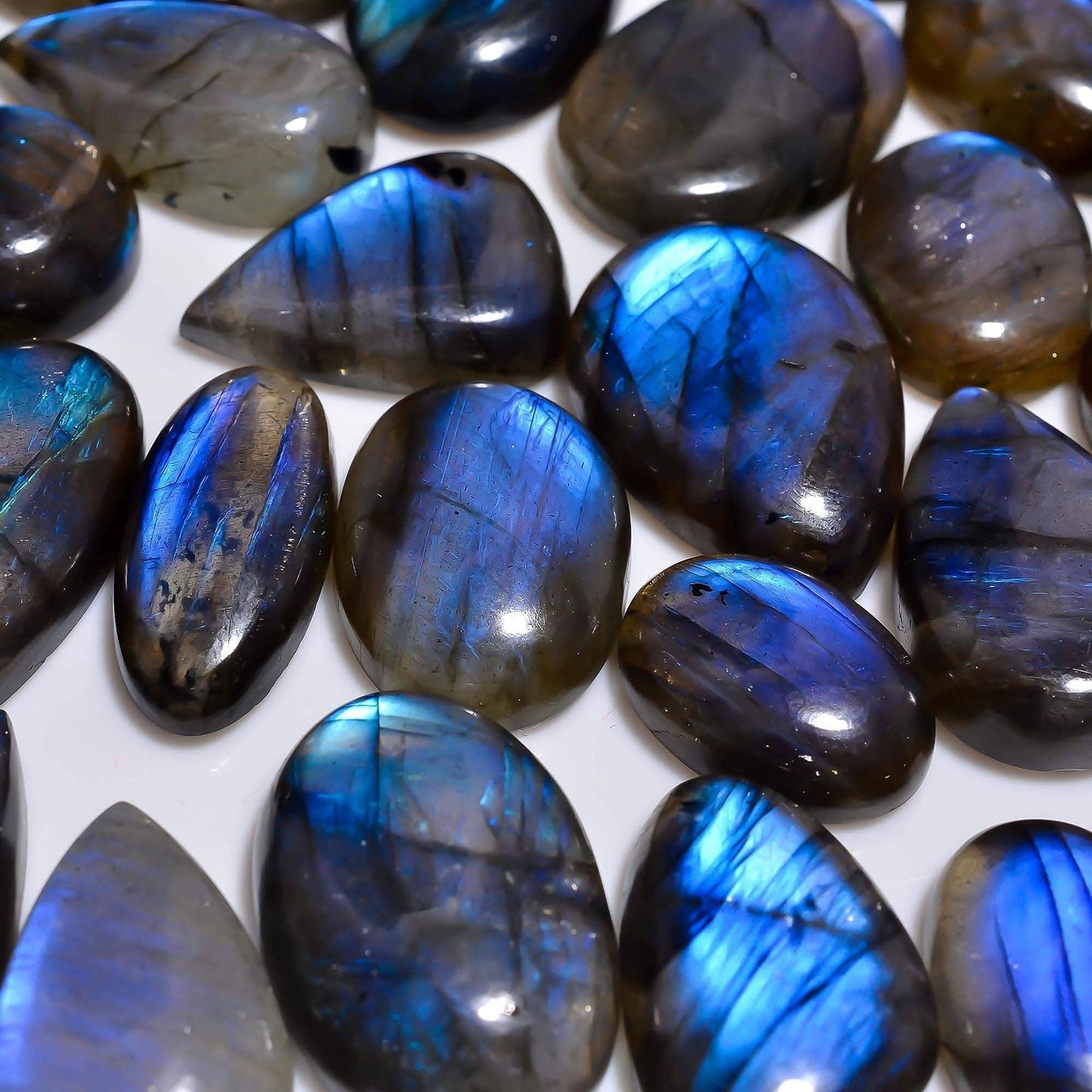 Collection of blue and brown labradorite gemstone healing properties​ on a white background