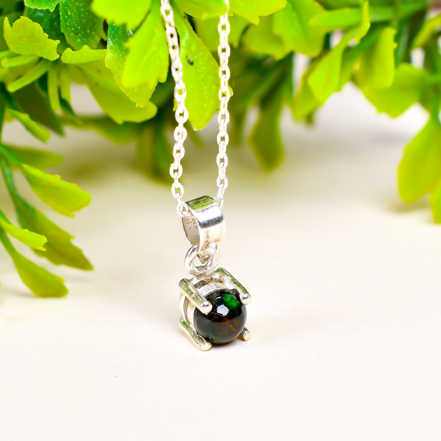 Certified 10 Ct Black Opal Pendant in round shape with vivid color play