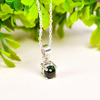 Certified 10 Ct Black Opal Pendant in round shape with vivid color play