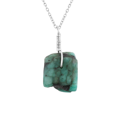 Turquoise stone necklace with silver chain on a white background