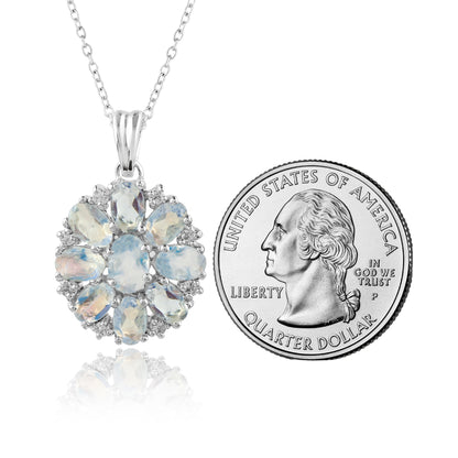 Opal pendant necklace next to a U.S. quarter dollar coin on a white background