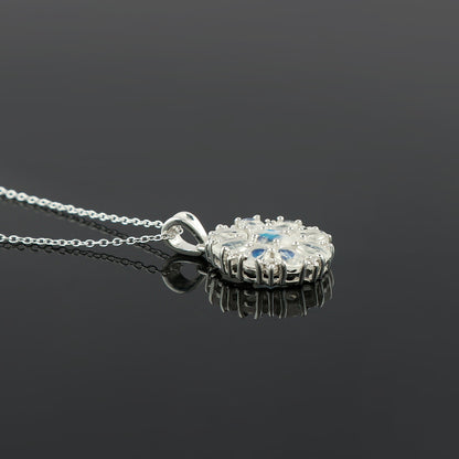 Silver pendant necklace on a black background