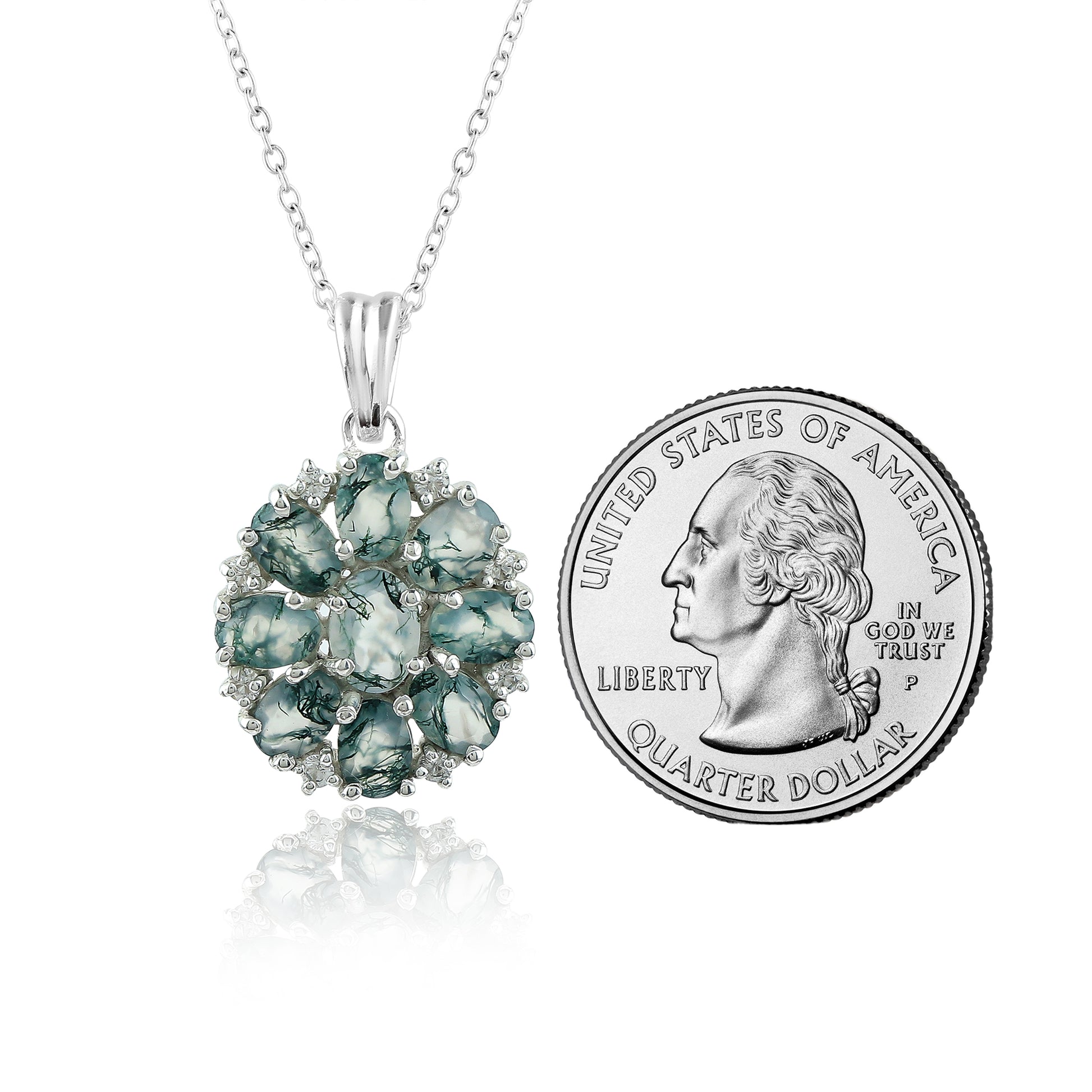 Green gemstone pendant with chain next to a U.S. quarter dollar coin for size comparison on a white background.