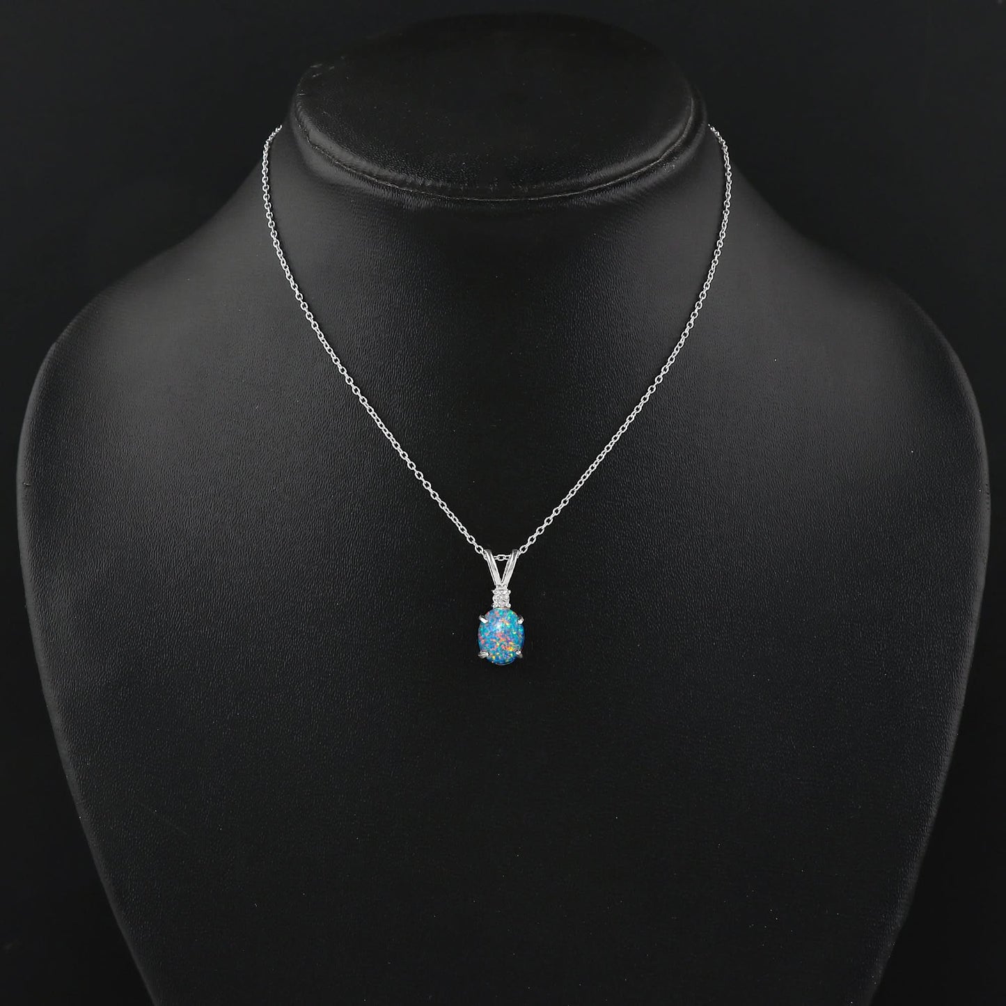 Silver necklace with a blue pendant on a black mannequin bust