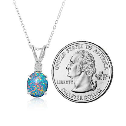 Opal pendant necklace next to a U.S. quarter dollar coin for size comparison on a white background