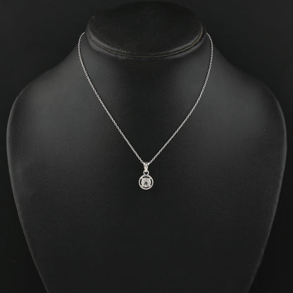 Silver necklace with a pendant on a black mannequin bust