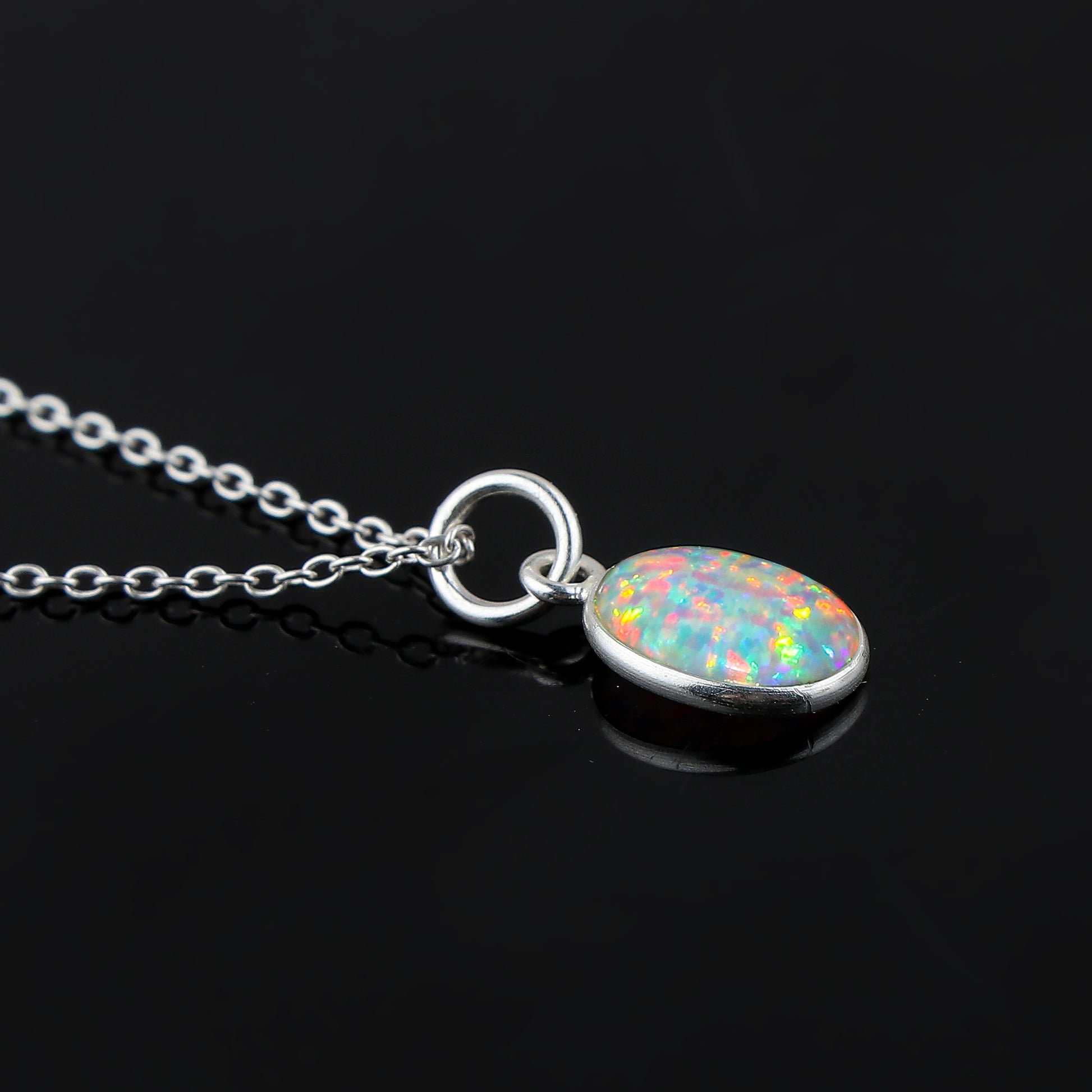 Elevating Gemstones in a 1.3 Ct Ethiopian Opal Pendant