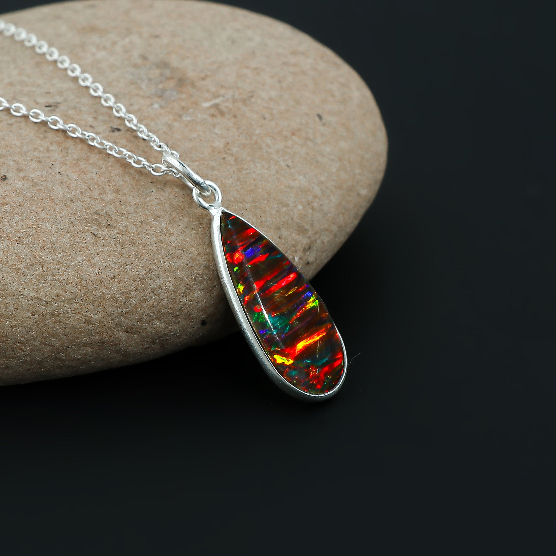 925 silver crafted pear-shaped pendant in 2.5 Ct Black Line Ethiopian Opal Stone