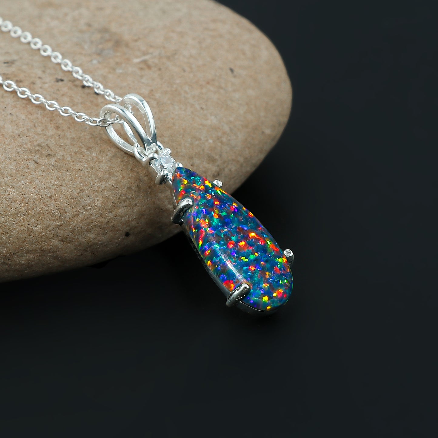 Elegant jewelry with 2.5 Ct Blue Dot Ethiopian Opal | Pear Shape