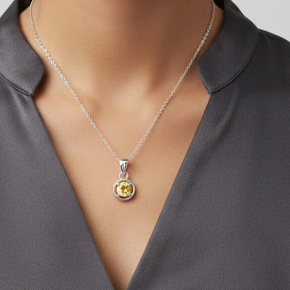 Vibrant yellow faceted  Citrine gemstone pendant in classic silver circular mount