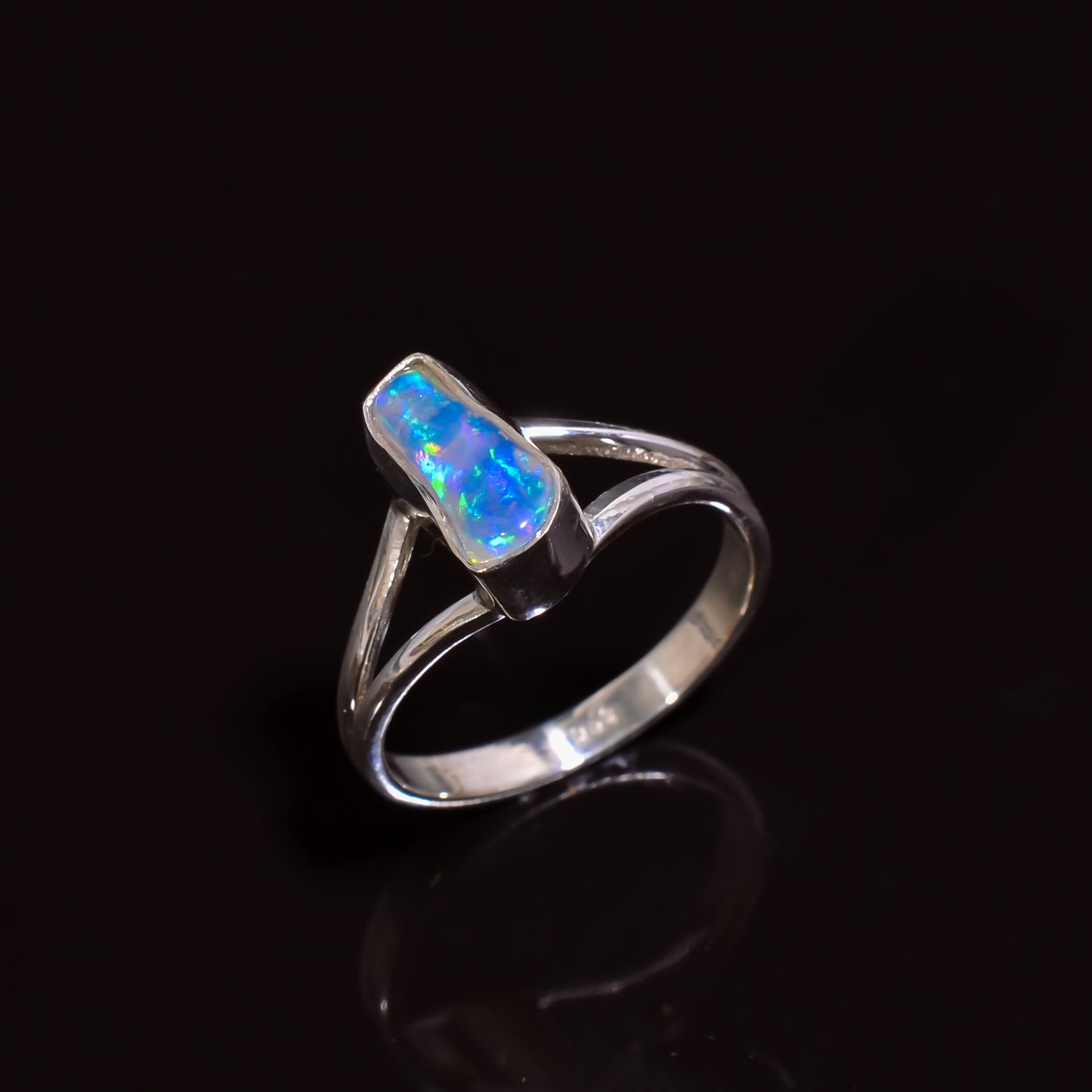 Artisan-made silver ring set with natural white Ethiopian opal, size 6.75