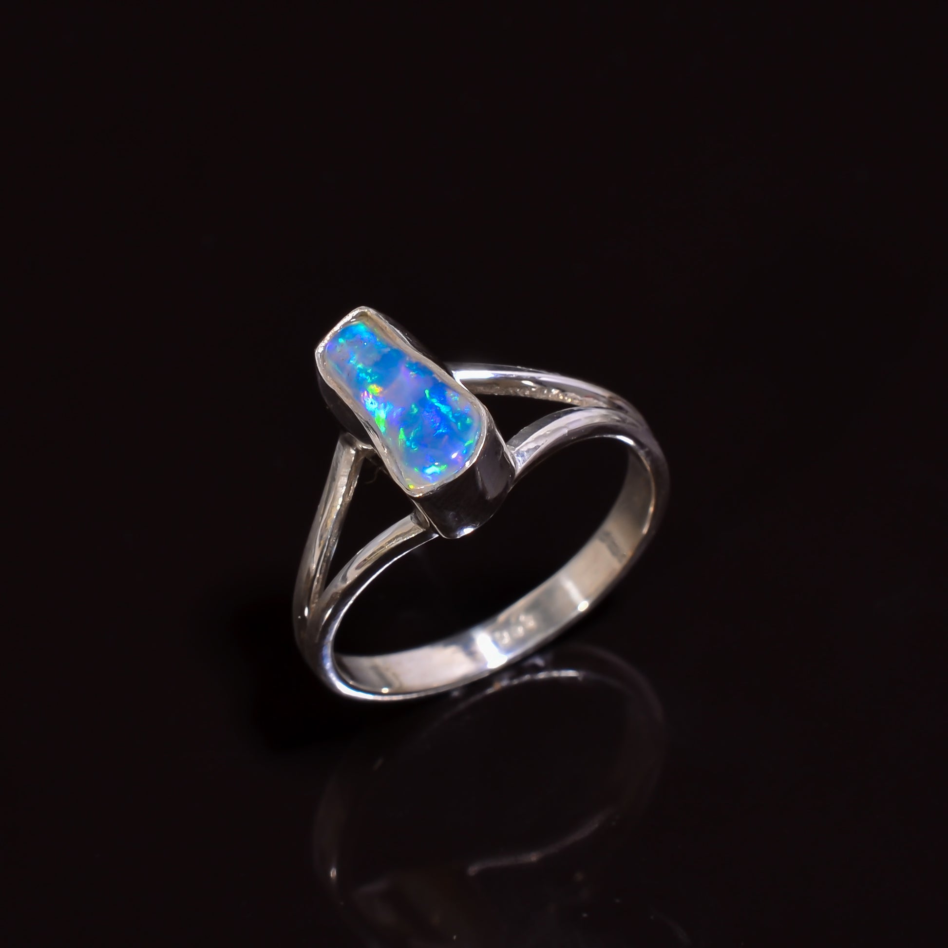 Artisan-made silver ring set with natural white Ethiopian opal, size 6.75