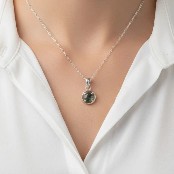 Natural green moss agate pendant with unique organic patterns on a silver chain