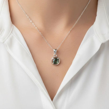 Natural green moss agate pendant with unique organic patterns on a silver chain