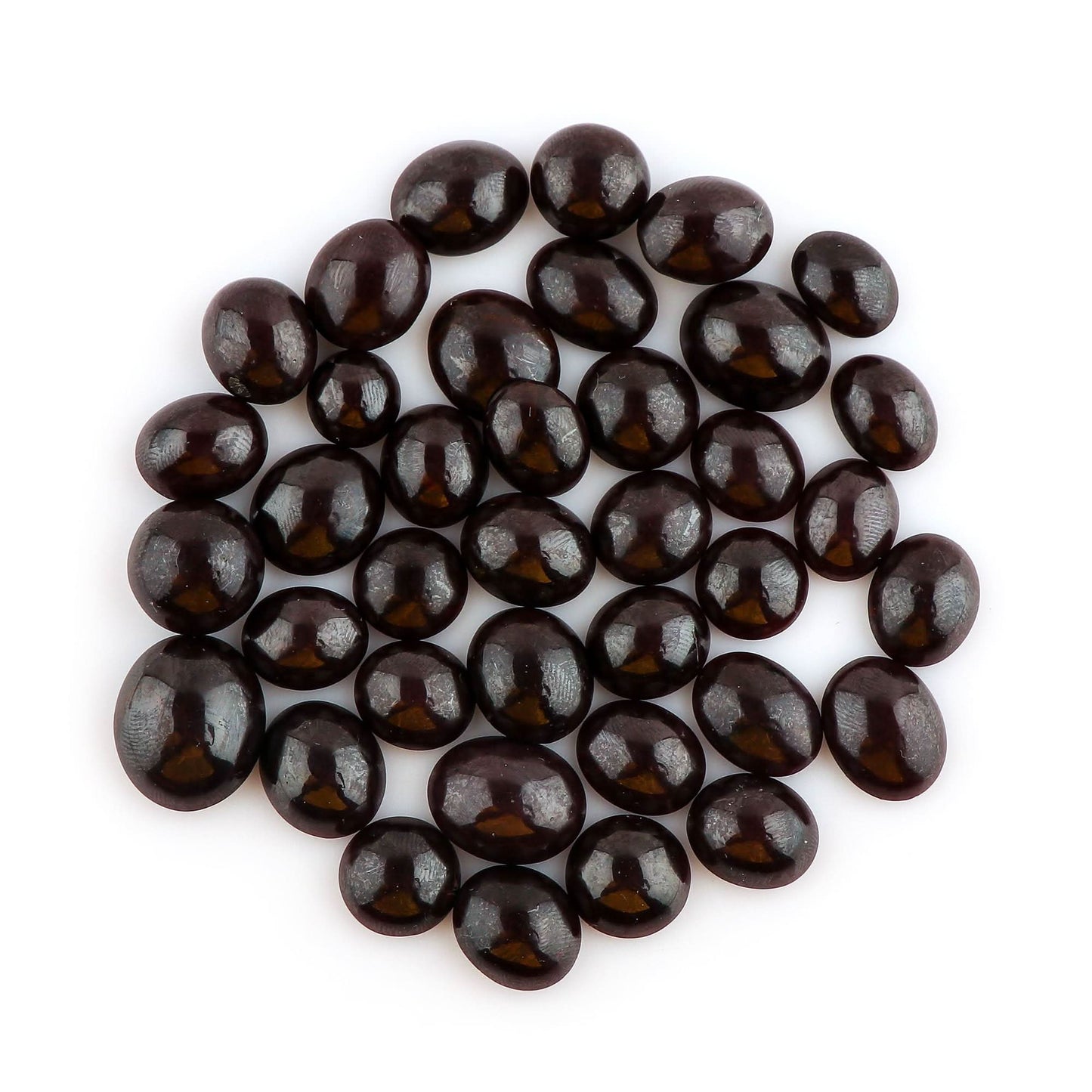 Natural red garnet gemstone showing rare star effect and polish.