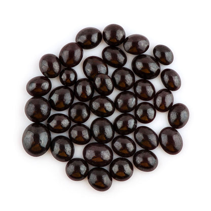 Natural red garnet gemstone showing rare star effect and polish.