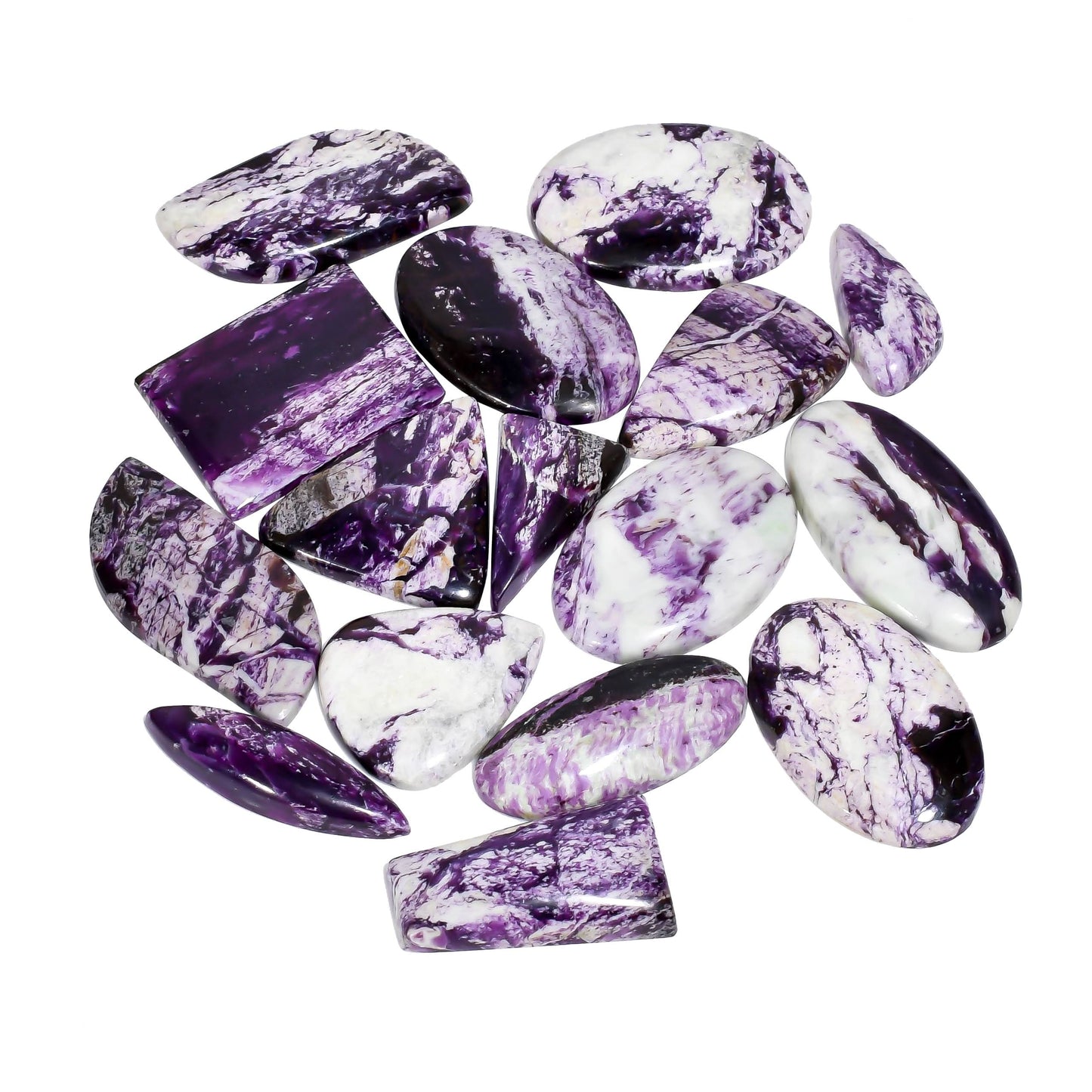Polished kammererite stone cabochons with deep violet hues.