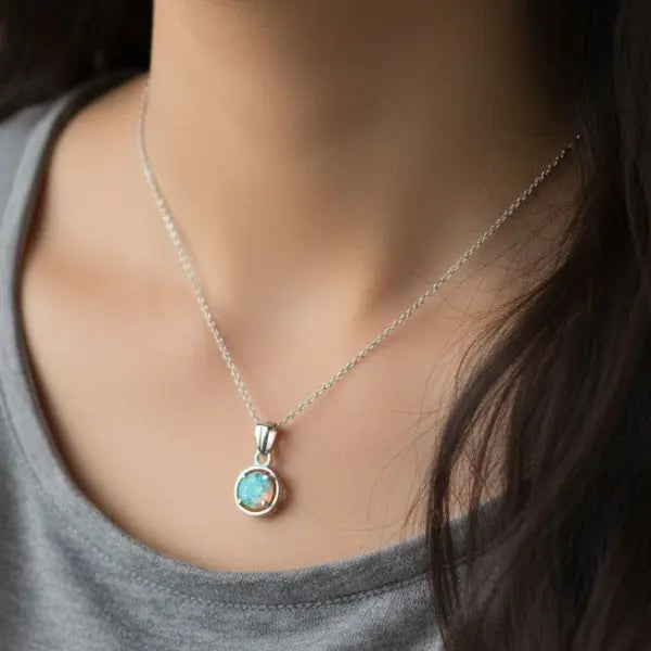 Elegant silver necklace featuring multiple raw Ethiopian opal droplet stones for a bohemian look
