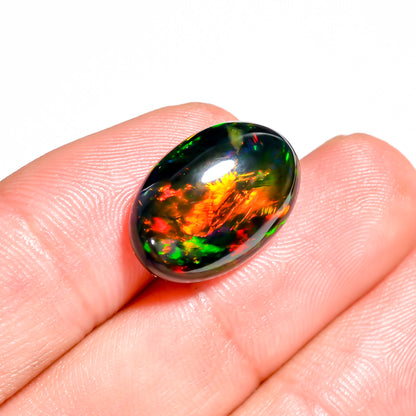 Embracing beauty captured in 7 Ct Black Ethiopian Opal Cabochon Fire Play 