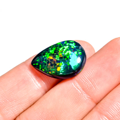 7.00 carat Black Ethiopian Opal gemstone with vibrant color play 
