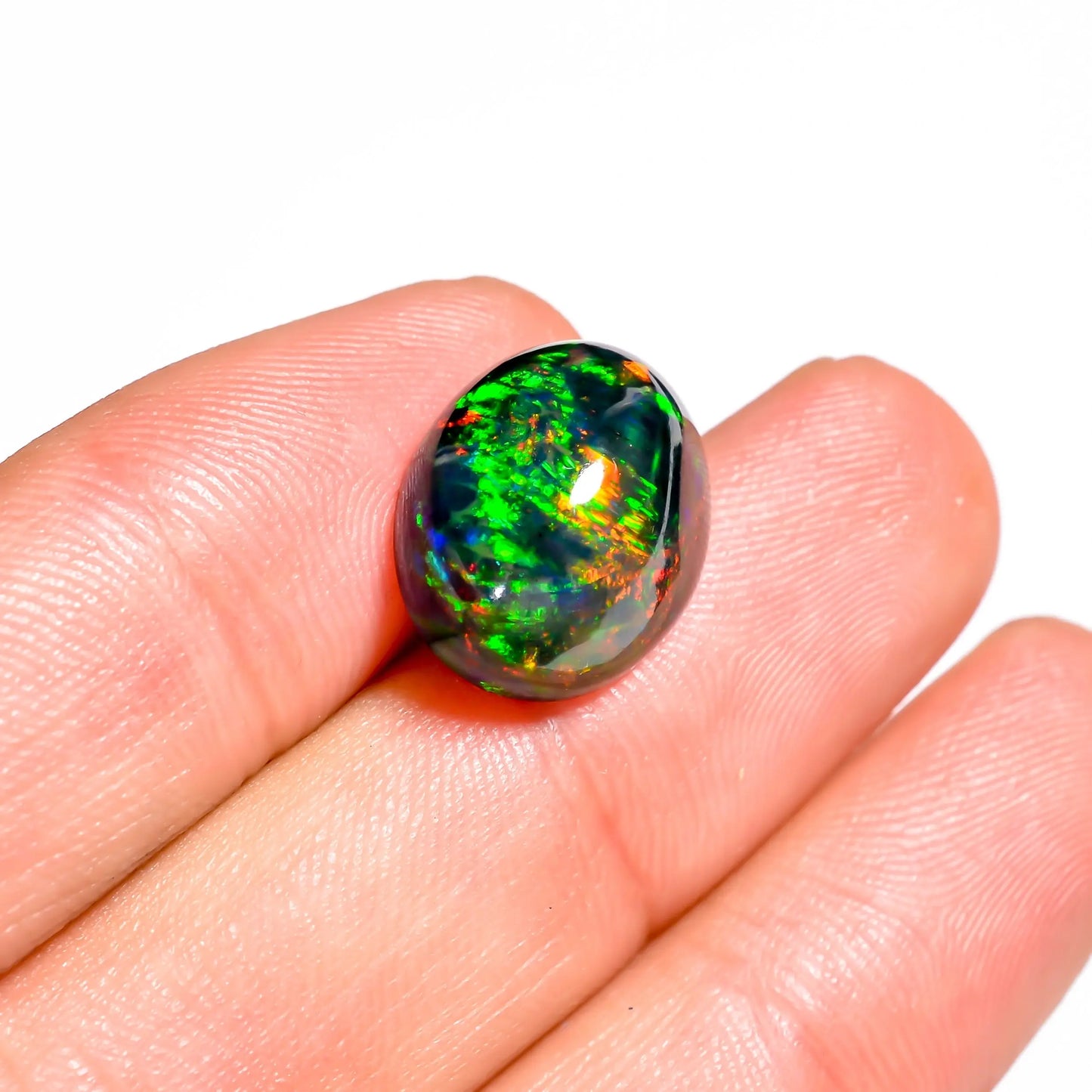 Loose oval-cut black opal glowing with vibrant hues - 6.50 carat 
