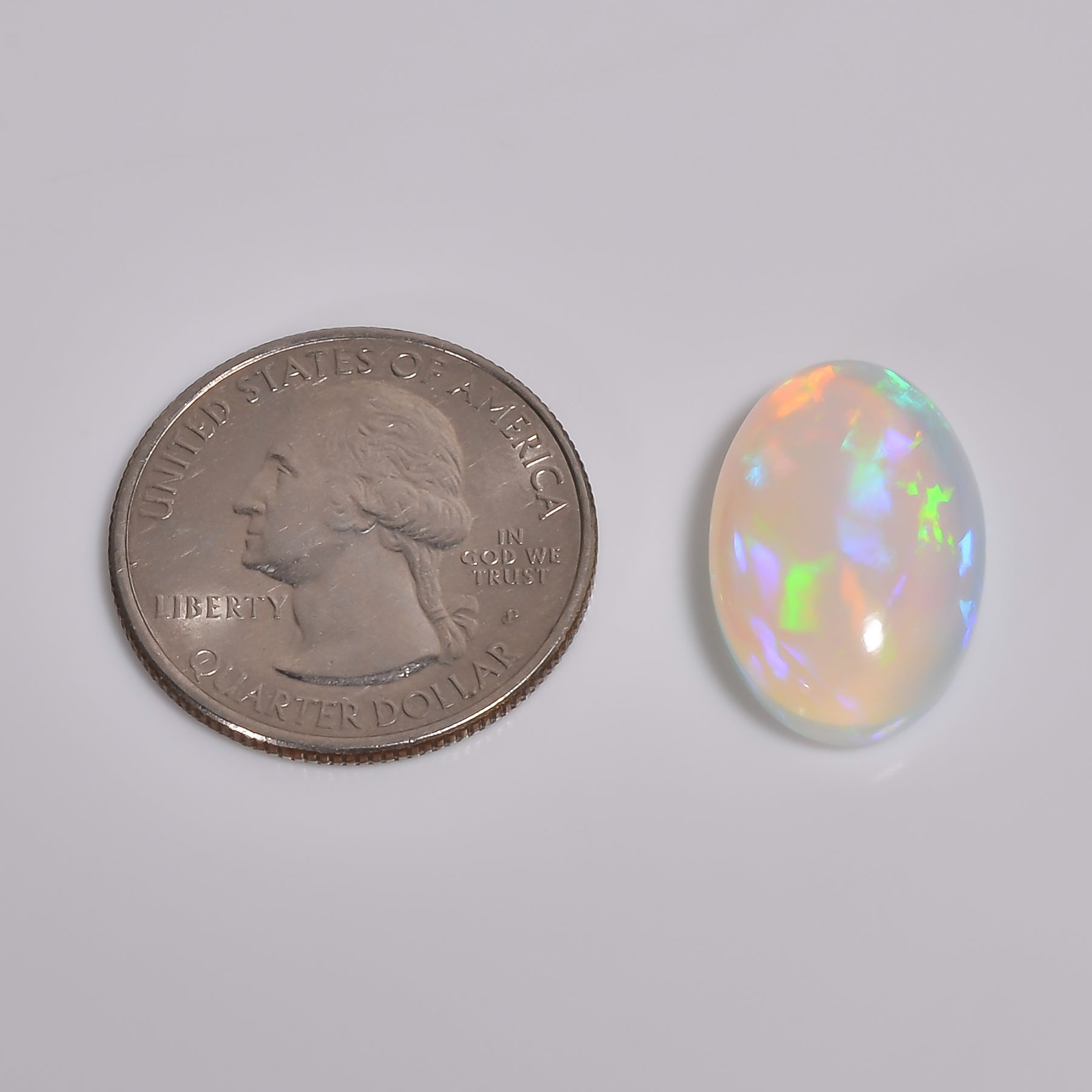 Natural loose 9.50 carat white Ethiopian opal cabochon with vibrant sparkle 
