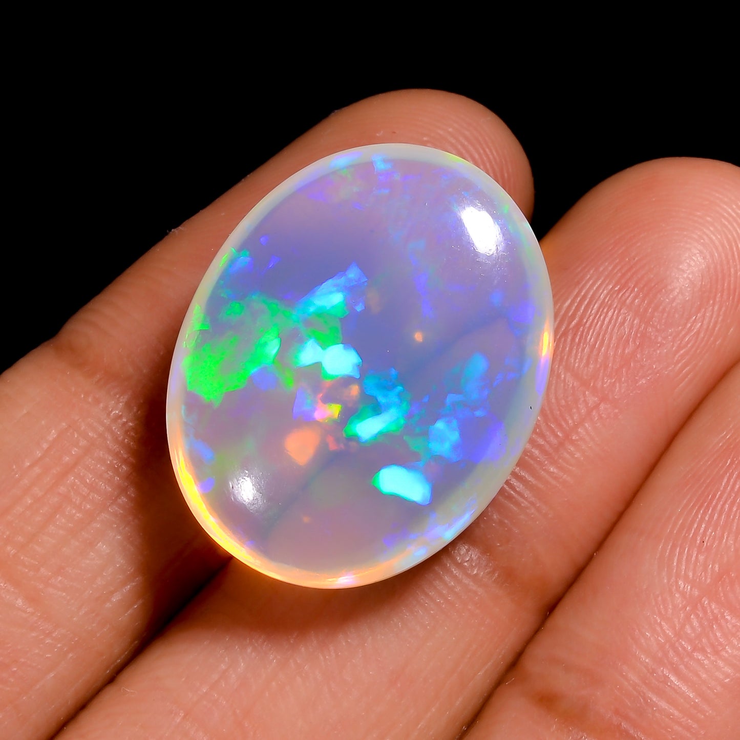 Beautiful 14.00 carat white Ethiopian opal loose oval gemstone, perfect for fine jewelry creation 
