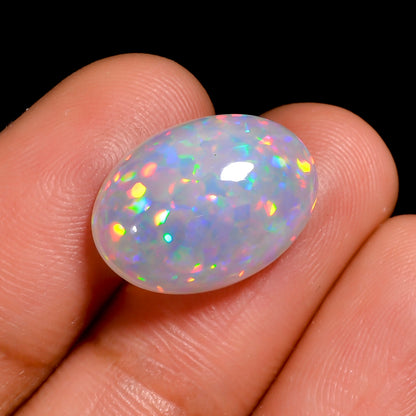 Genuine 6.00 Ct white Ethiopian opal gemstone showcasing radiant play of colors.
