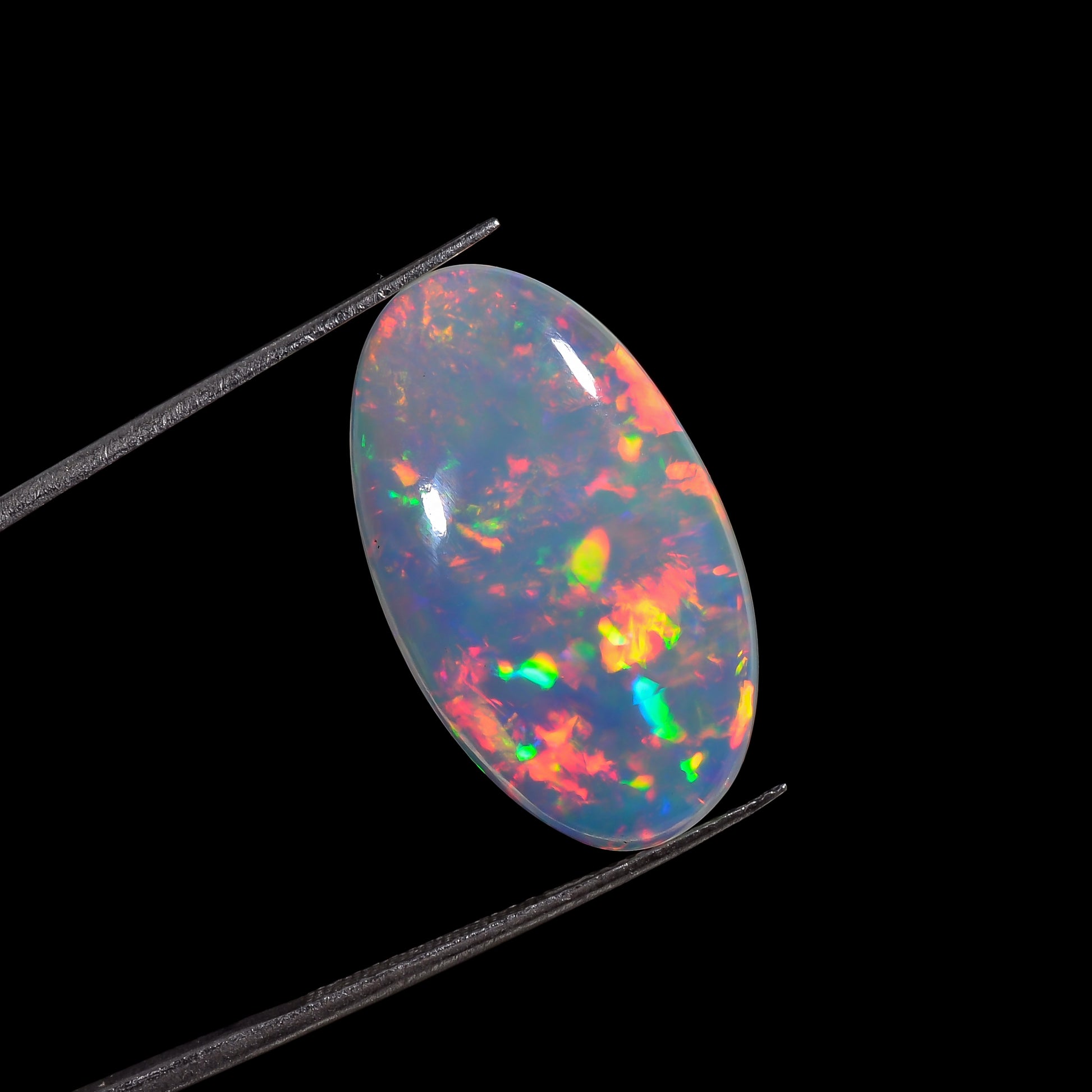 Genuine Ethiopian white opal gemstone, 10.00 carat, with colorful flashes.
