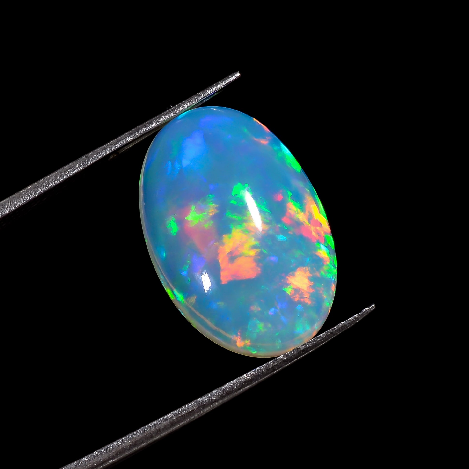 Premium oval cut white Ethiopian Opal flashy stone with brilliant color play 

