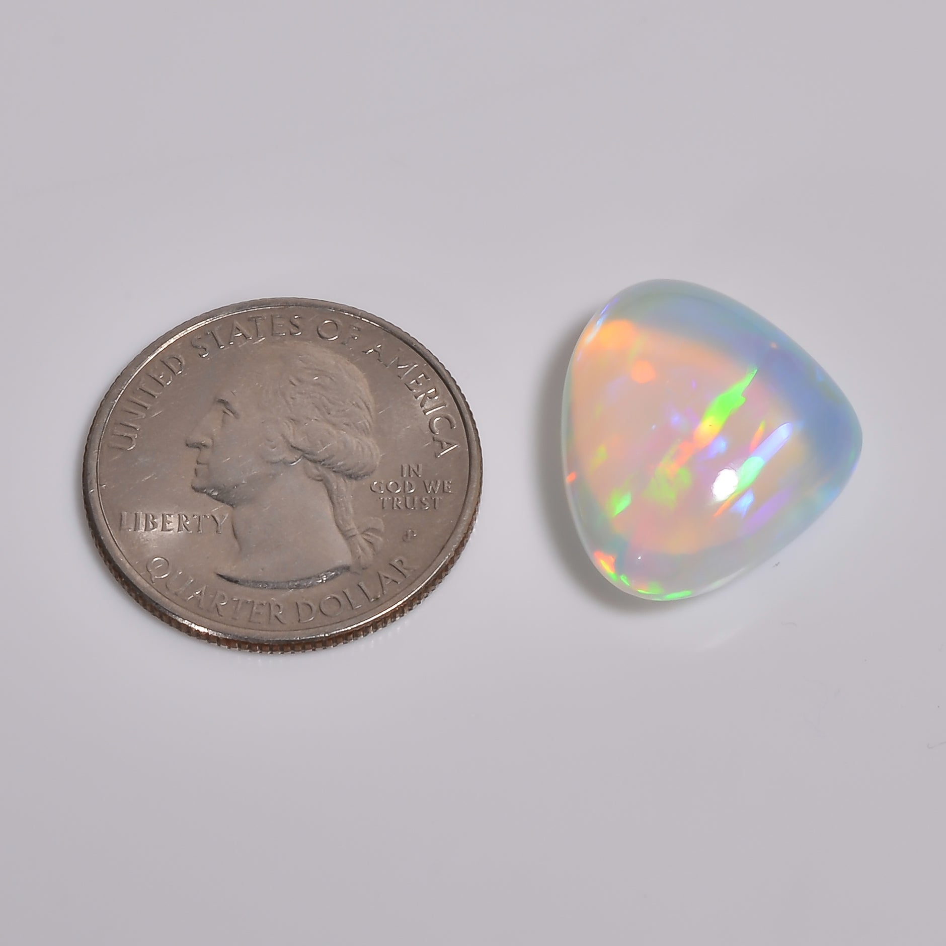 Heart-shaped 16.50 carat White Ethiopian opal gemstone with multi-flashy color
