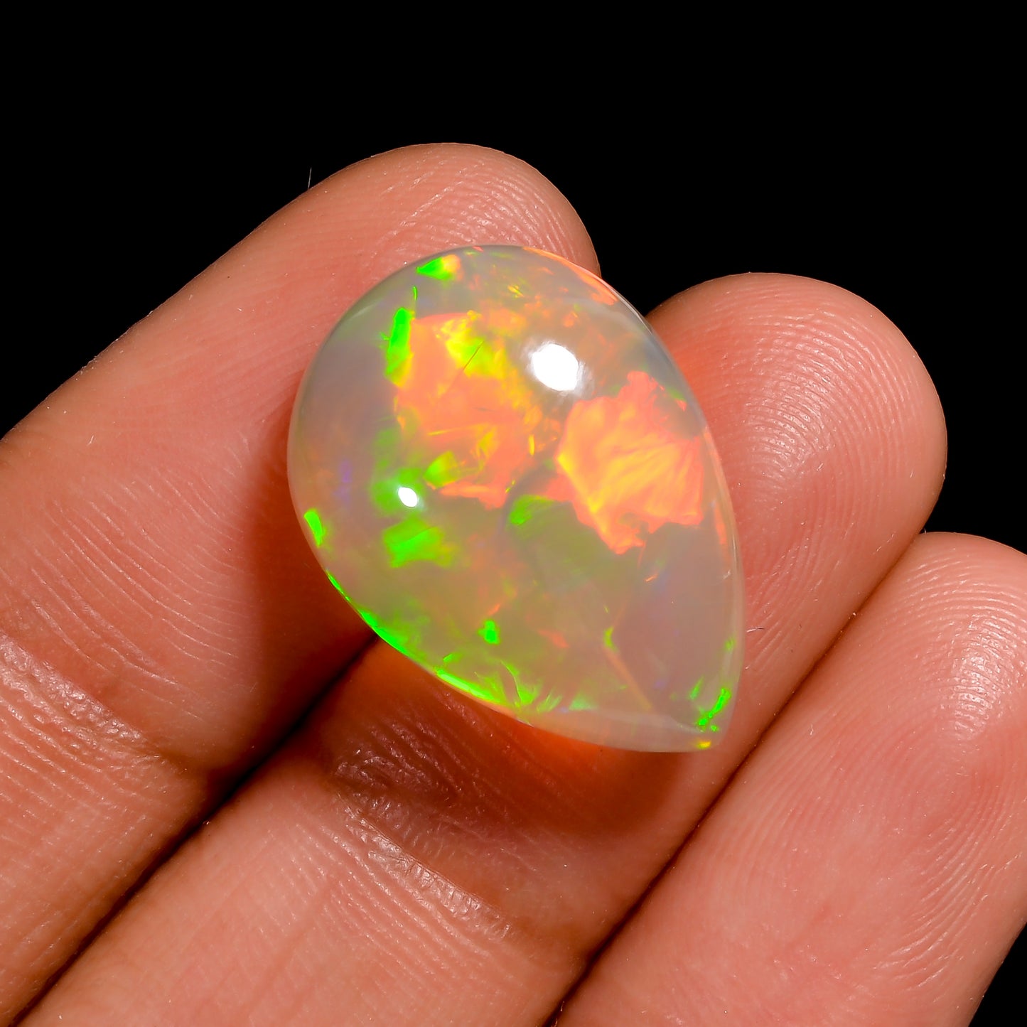 Stunning 9.00 ct Ethiopian Opal cabochon with multi-Colorfire, pear-shaped gemstone 
